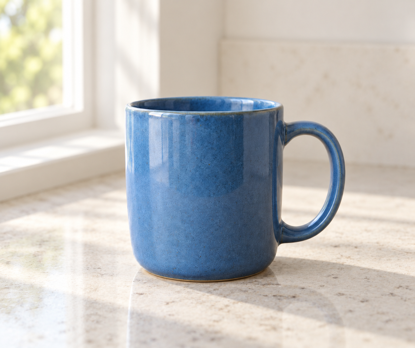 The generated blue mug edited onto a light stone counter beside a window.
